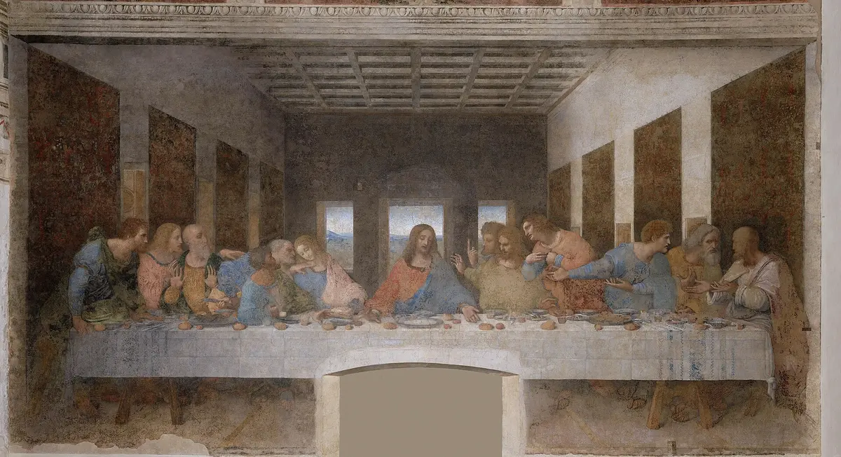 Leonardo da Vinci's Last Supper on the refectory wall: Christ at the centre of a long table with six apostles on each side, under a coffered ceiling